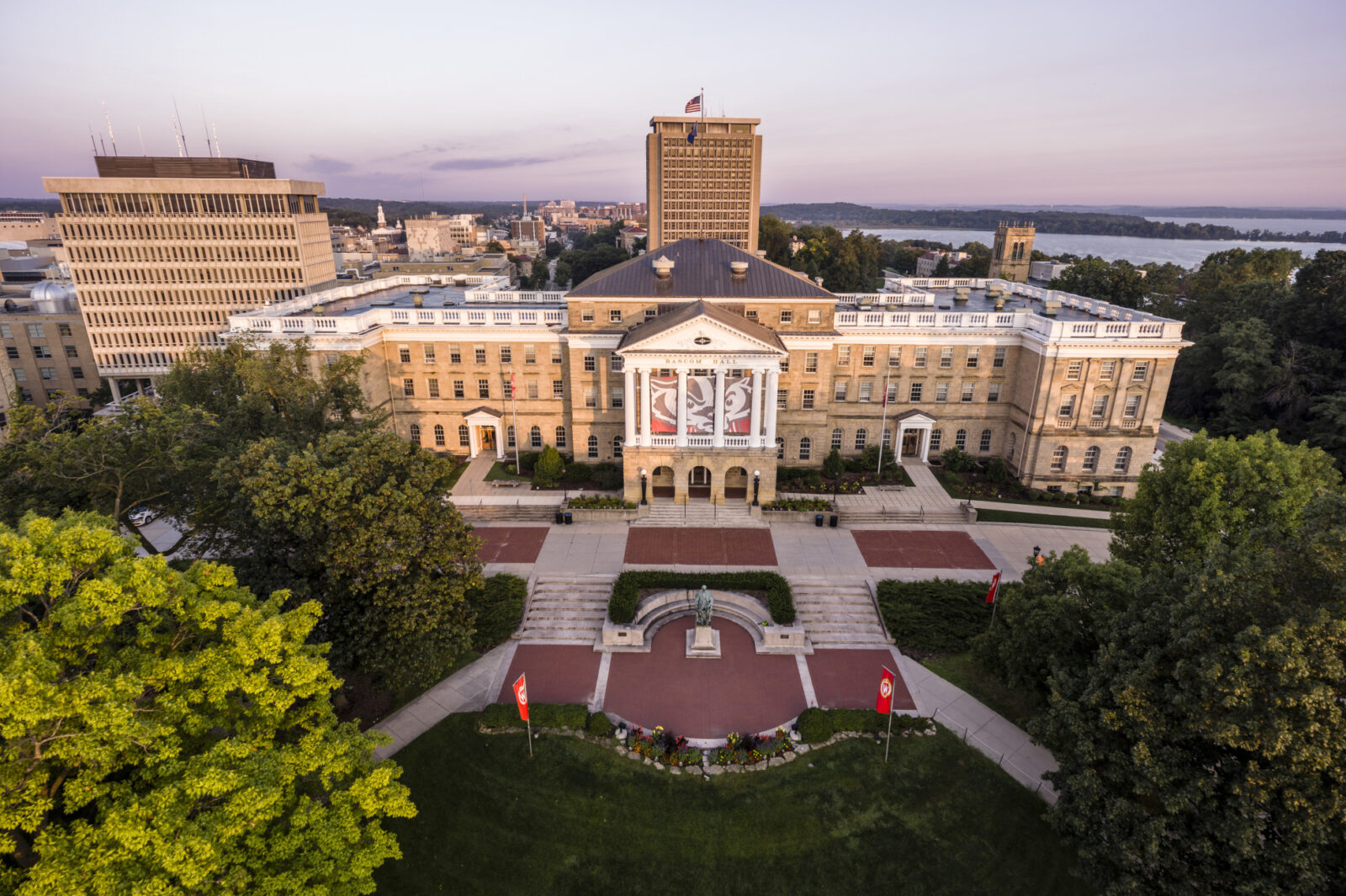 Aerial view of Bascom Hall and Bascom Hill, with Van Hise Hall, the Madison skyline, and Lake Mendota beyond.